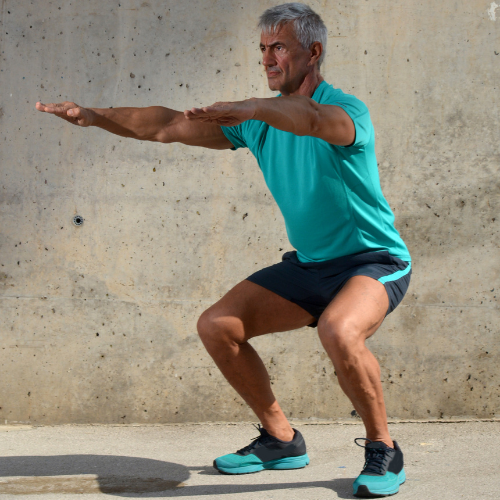 man exercising squats